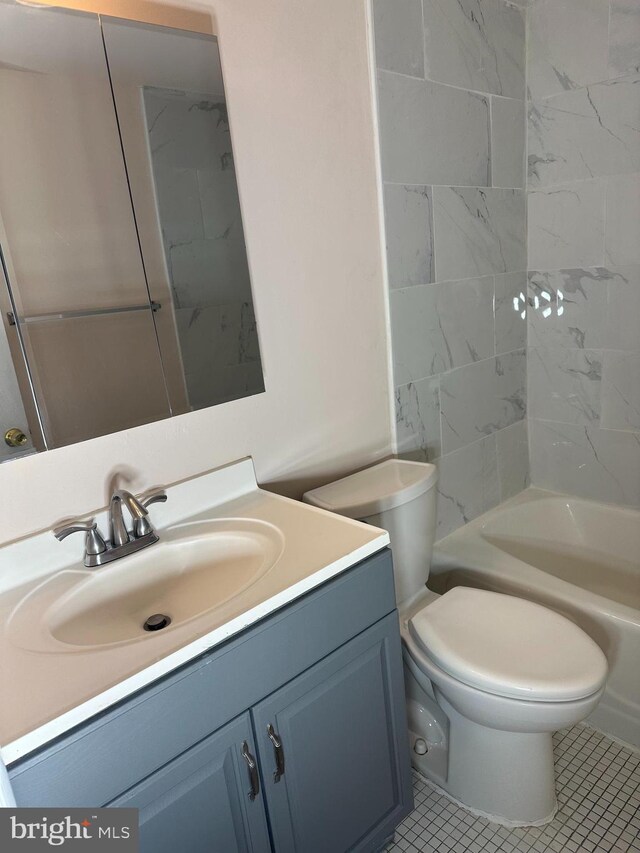 9250 Edwards Way Unit 101-A, Hyattsville, MD 20783 - bathroom featuring toilet,  shower combination, and vanity