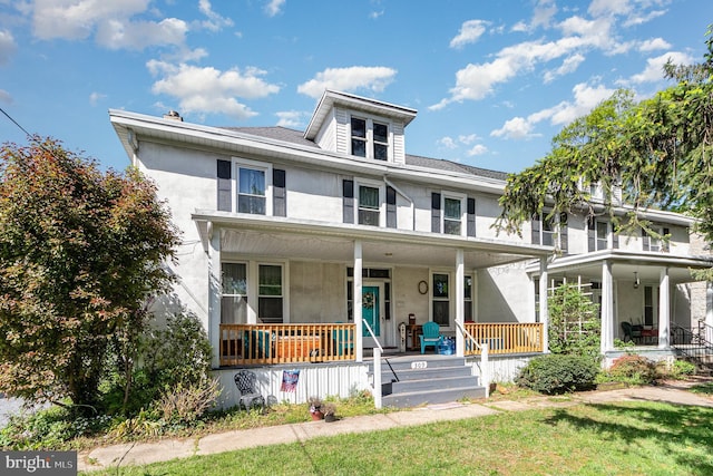 309 N N Morris St, Shippensburg, PA 17257 - traditional style home with a porch, stucco siding, and a front yard
