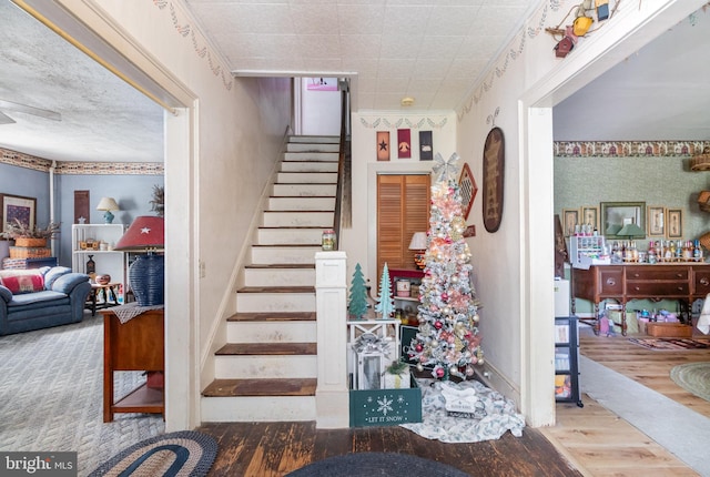 309 N N Morris St, Shippensburg, PA 17257 - staircase with wood finished floors and wallpapered walls