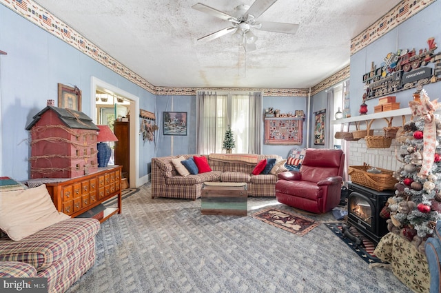 309 N N Morris St, Shippensburg, PA 17257 - living area with a textured ceiling, carpet flooring, ceiling fan, and a wood stove