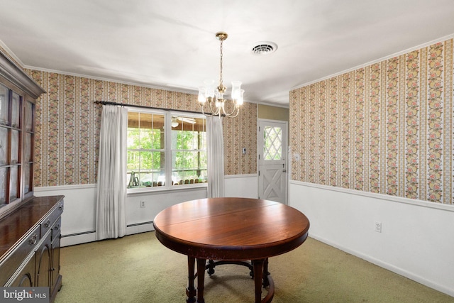 dining space featuring ornamental molding, visible vents, a chandelier, wainscoting, and wallpapered walls
