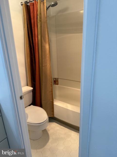 205 Yoakum Pkwy Unit 319, Alexandria, VA 22304 - full bathroom with tile patterned flooring, toilet, and shower / tub combo