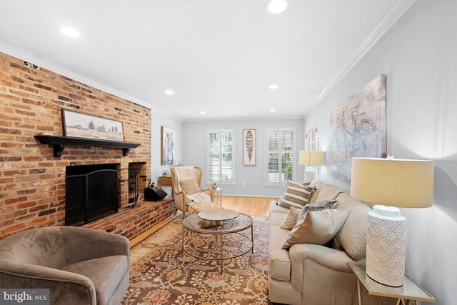 living area with recessed lighting, crown molding, a brick fireplace, and wood finished floors