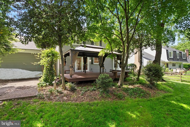 back of house featuring a gazebo and a deck