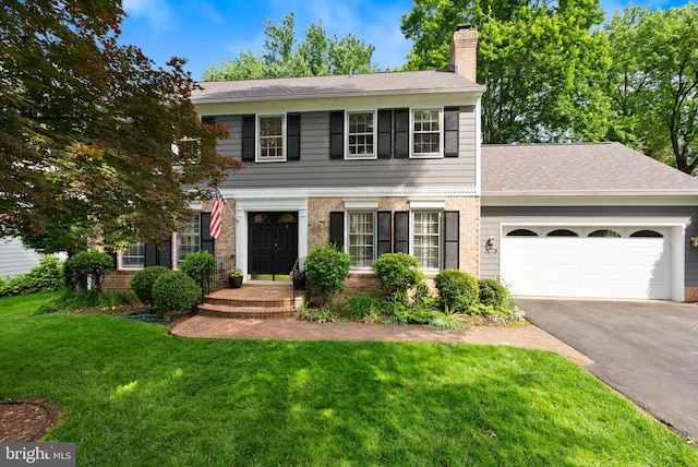 view of front facade featuring asphalt driveway, a chimney, a front lawn, a garage, and a shingled roof
