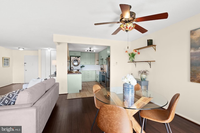 307 Yoakum Pkwy Unit 821, Alexandria, VA 22304 - dining room with stacked washer and clothes dryer, dark wood-type flooring, and ceiling fan