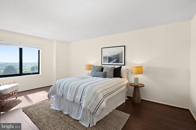 307 Yoakum Pkwy Unit 821, Alexandria, VA 22304 - bedroom featuring wood finished floors and baseboards