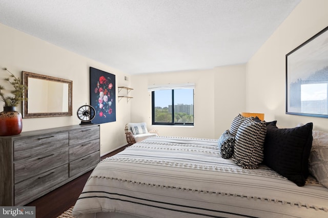 307 Yoakum Pkwy Unit 821, Alexandria, VA 22304 - bedroom with dark wood-style flooring and baseboards
