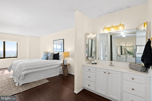 307 Yoakum Pkwy Unit 821, Alexandria, VA 22304 - bedroom featuring a sink, multiple windows, and dark wood finished floors