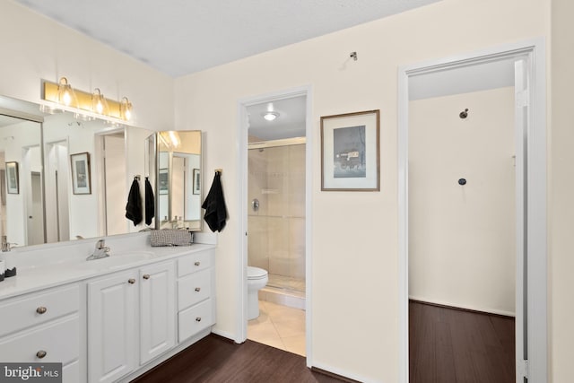307 Yoakum Pkwy Unit 821, Alexandria, VA 22304 - full bathroom with a stall shower, vanity, toilet, and wood finished floors