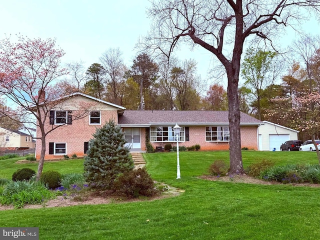 7410 Good Luck Rd, Lanham, MD 20706 - split level home featuring brick siding, a front lawn, and a chimney