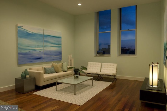 living room with baseboards, recessed lighting, and wood finished floors