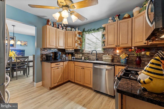 15 Sutton Pl, Helmetta, NJ 08828 - kitchen featuring stainless steel appliances, a sink, light wood-style flooring, and tasteful backsplash