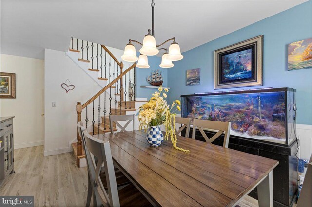 15 Sutton Pl, Helmetta, NJ 08828 - dining area featuring light wood finished floors, stairs, baseboards, and a notable chandelier