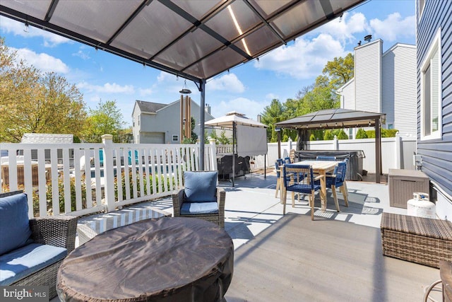 15 Sutton Pl, Helmetta, NJ 08828 - wooden deck with a hot tub, a gazebo, fence, a patio, and outdoor dining area