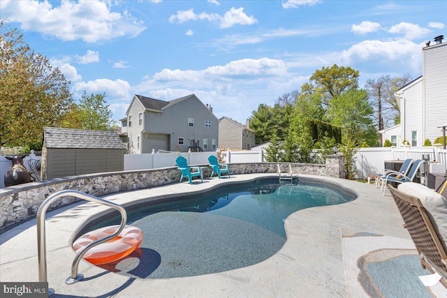 15 Sutton Pl, Helmetta, NJ 08828 - view of pool with a patio area, a storage shed, an outbuilding, a fenced backyard, and a fenced in pool