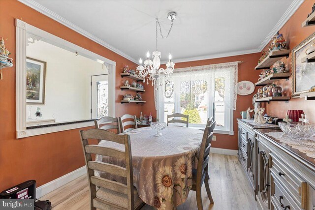 15 Sutton Pl, Helmetta, NJ 08828 - dining space featuring a chandelier, light wood-style flooring, crown molding, and baseboards