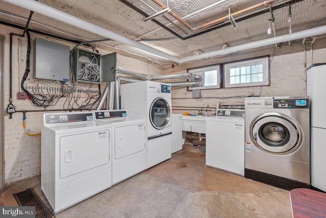 community laundry room with washing machine and dryer