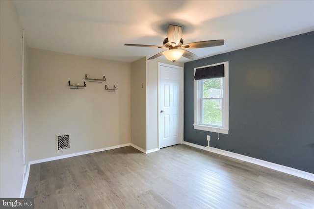 235 Wyoming Ave, Enola, PA 17025 - spare room with wood finished floors, a ceiling fan, and baseboards