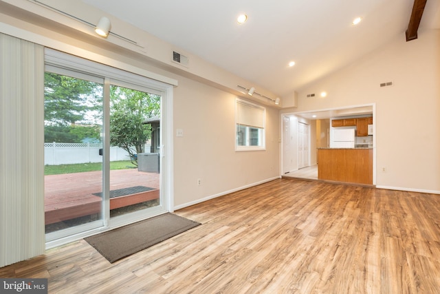 interior space with lofted ceiling, recessed lighting, light wood-style floors, and visible vents