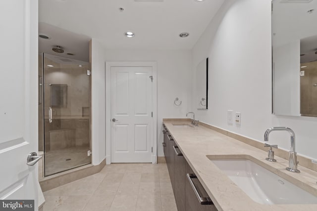 bathroom with a shower stall, tile patterned flooring, double vanity, and recessed lighting