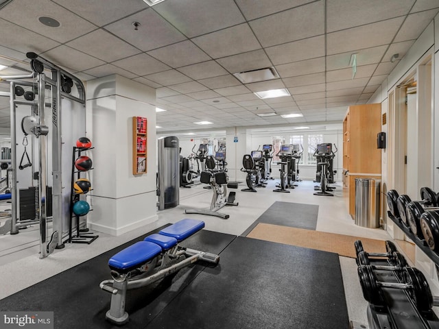 workout area with a paneled ceiling