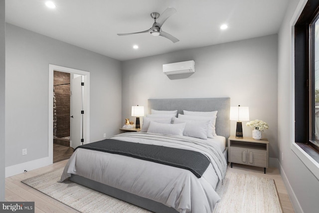 10 Mccready Aly, Lambertville, NJ 08530 - bedroom with recessed lighting, an AC wall unit, wood finished floors, baseboards, and connected bathroom