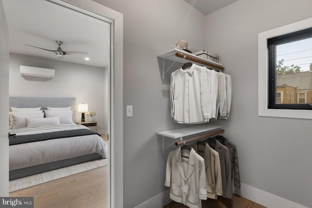 10 Mccready Aly, Lambertville, NJ 08530 - walk in closet featuring a wall mounted AC, wood finished floors, and a ceiling fan