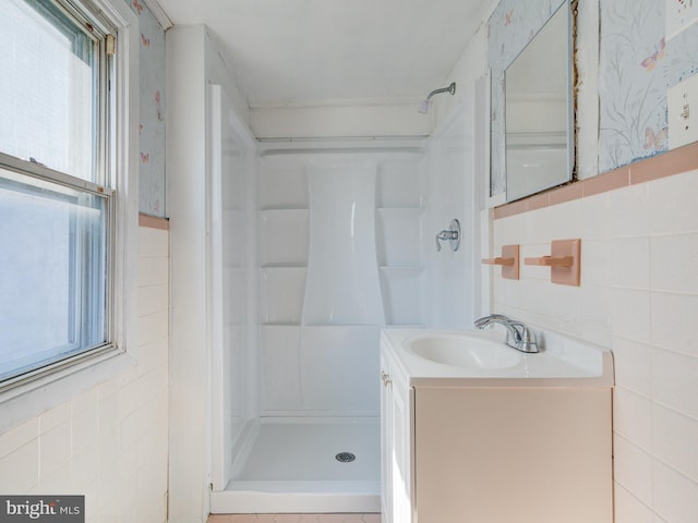 2030-32 E Somerset St, Philadelphia, PA 19134 - full bath with a shower stall, tile walls, and vanity