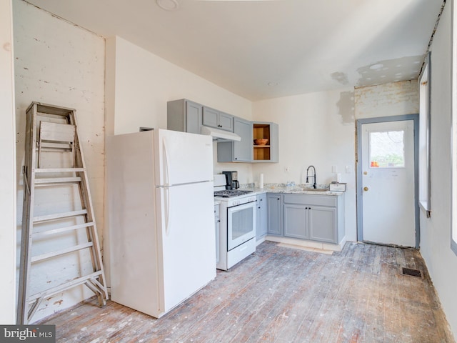 2030-32 E Somerset St, Philadelphia, PA 19134 - kitchen with white appliances, under cabinet range hood, light wood-style floors, and gray cabinetry