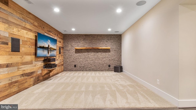 interior space with recessed lighting, carpet flooring, and wood walls