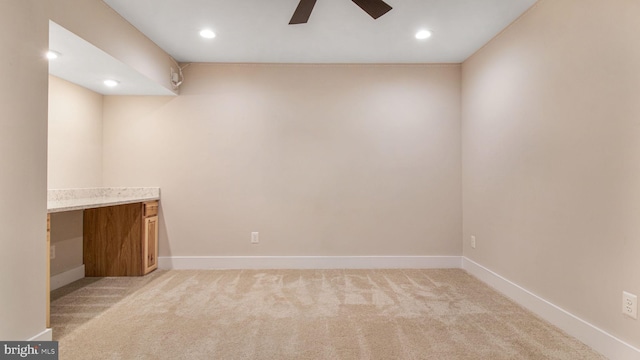 basement with light carpet, a ceiling fan, baseboards, and recessed lighting