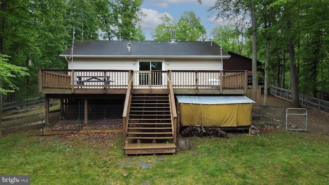back of property with stairs and a deck
