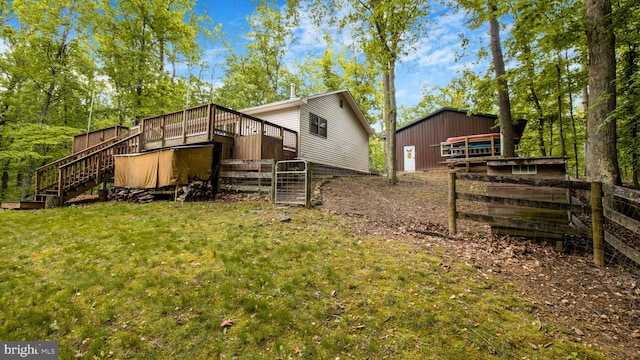 back of property with stairway and a wooden deck