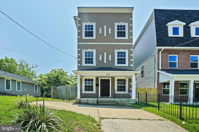 5823 Field Pl NE, Washington, DC 20019 - view of front of house with a porch, stucco siding, and fence