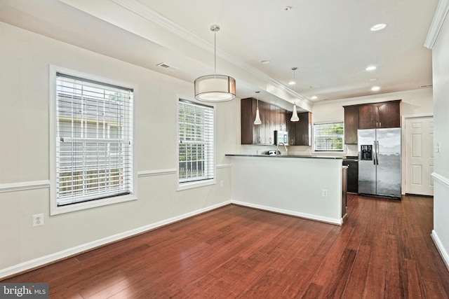 5823 Field Pl NE, Washington, DC 20019 - kitchen featuring ornamental molding, visible vents, dark brown cabinetry, dark wood-style floors, and appliances with stainless steel finishes