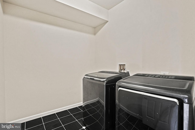 5823 Field Pl NE, Washington, DC 20019 - laundry area with laundry area, independent washer and dryer, dark tile patterned flooring, and baseboards