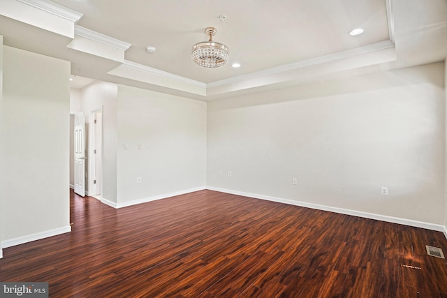 5823 Field Pl NE, Washington, DC 20019 - unfurnished room with a tray ceiling, wood finished floors, baseboards, and ornamental molding