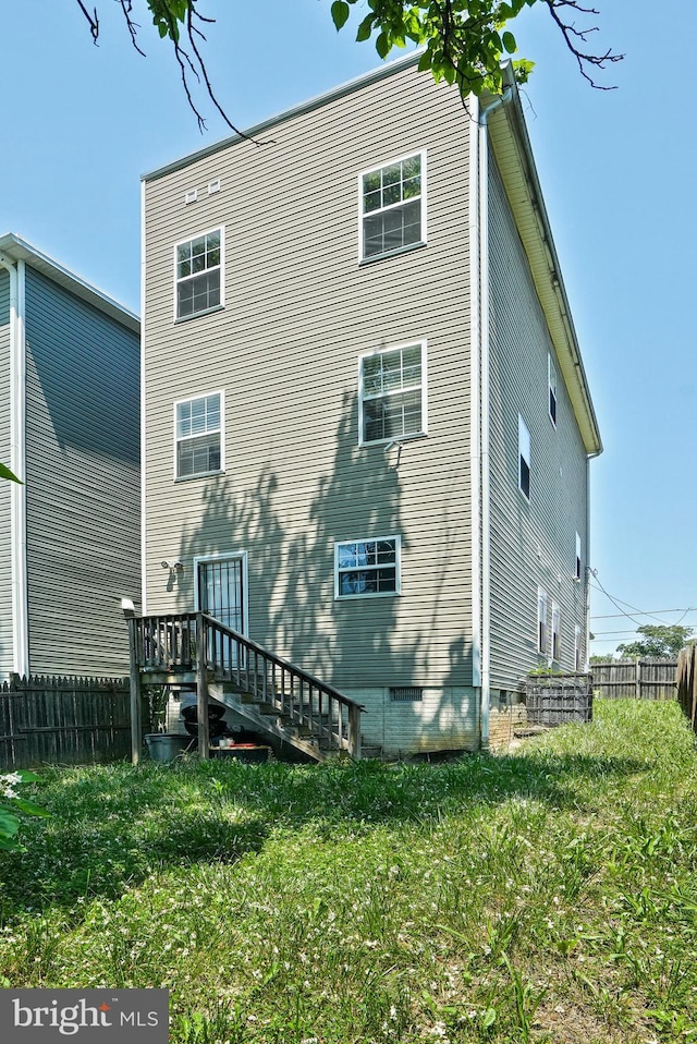 5823 Field Pl NE, Washington, DC 20019 - back of property with a lawn and fence