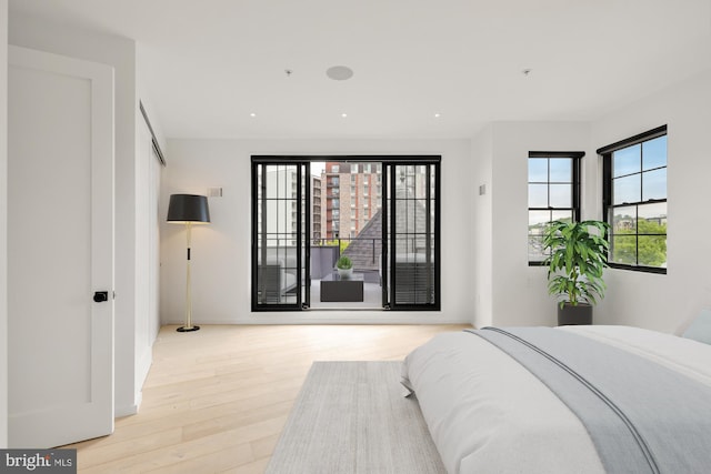 bedroom featuring light wood finished floors and recessed lighting
