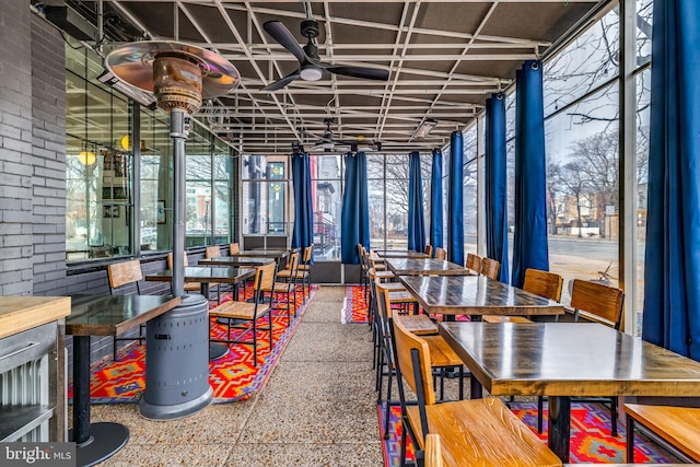 dining room featuring a ceiling fan and floor to ceiling windows
