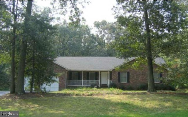 9180 Rolling Meadow Run, Pasadena, MD 21122 - ranch-style home with covered porch, a front yard, and brick siding