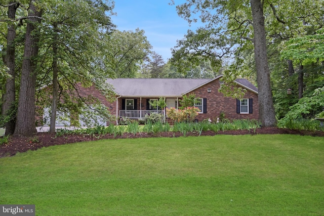 9180 Rolling Meadow Run, Pasadena, MD 21122 - ranch-style home with brick siding, a front yard, and a porch