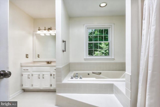 9180 Rolling Meadow Run, Pasadena, MD 21122 - bathroom featuring a garden tub and vanity