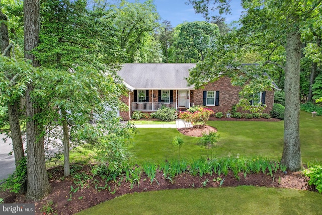 9180 Rolling Meadow Run, Pasadena, MD 21122 - view of front of property with brick siding, a porch, and a front lawn