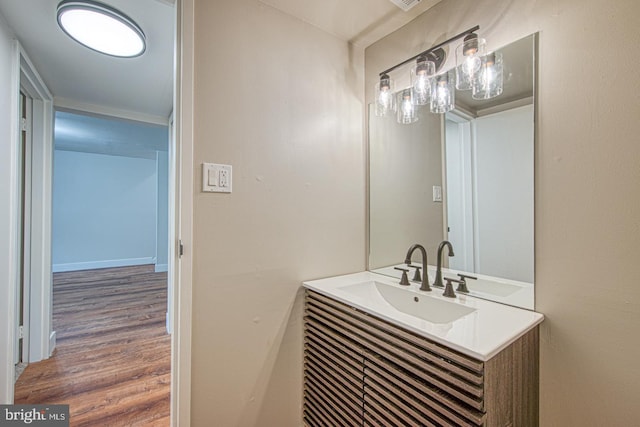 bathroom with vanity and wood finished floors