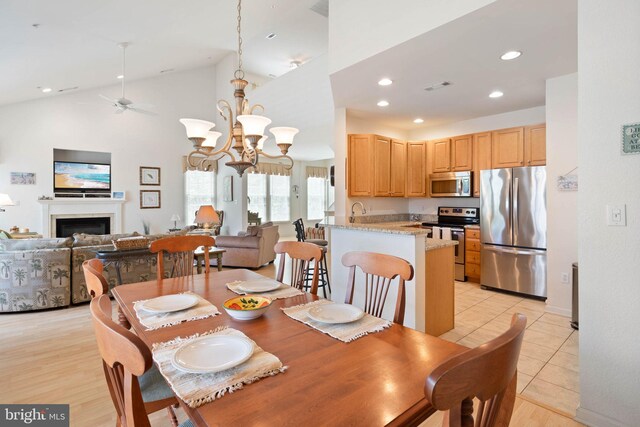 53 Willow Oak Ave Unit 53D, Ocean View, DE 19970 - dining space with a ceiling fan, a fireplace, recessed lighting, a chandelier, and light tile patterned floors