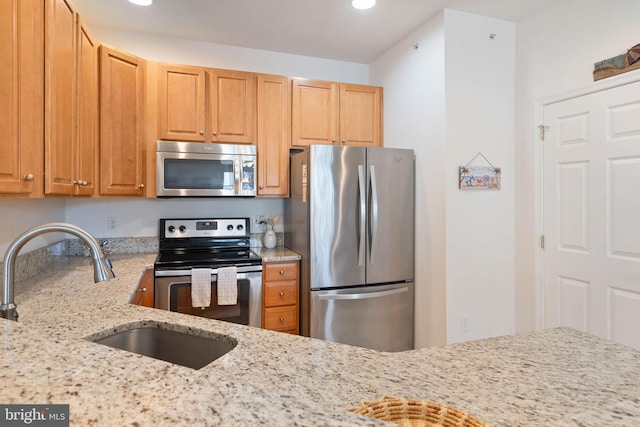 53 Willow Oak Ave Unit 53D, Ocean View, DE 19970 - kitchen featuring appliances with stainless steel finishes, a sink, light stone countertops, and recessed lighting