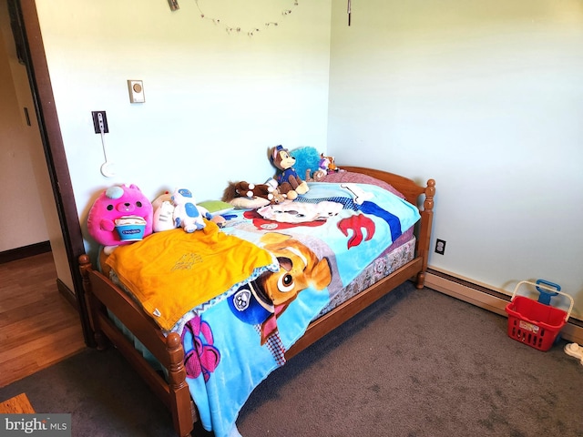 bedroom with a baseboard heating unit