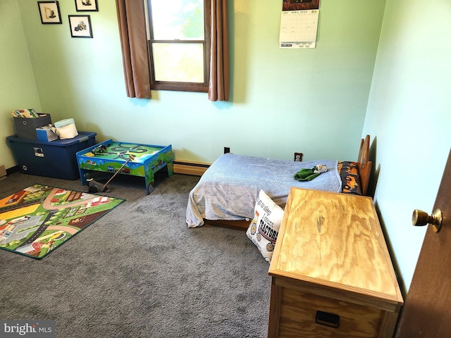 bedroom with carpet and baseboard heating